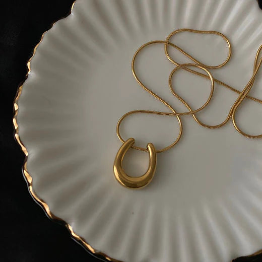 Golden Sculpted Loop Pendant Necklace