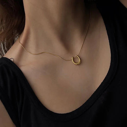 Golden Sculpted Loop Pendant Necklace